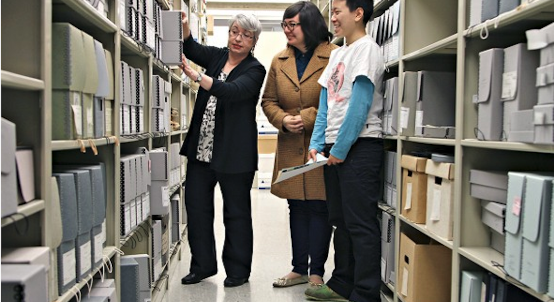 Peggy Glowacki, Naomi Salcedo, and Vicky TaiPeggy Glowacki, Special Collections Librarian, (left) works with students when the Queer Asian American Archives was created.